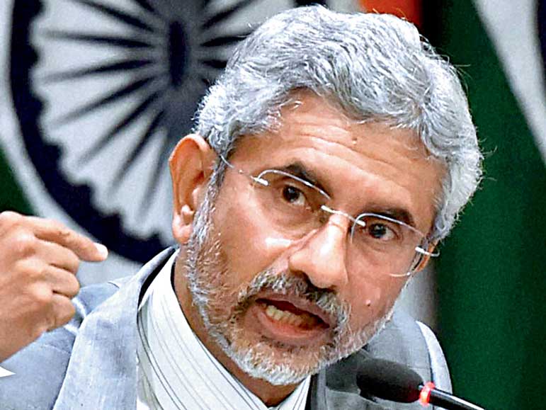 India says committed to peace, but will react to Pakistan's firing