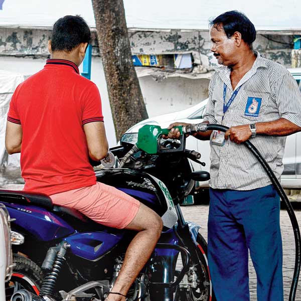 Despite of rule announcement, bikers taking petrol without helmet