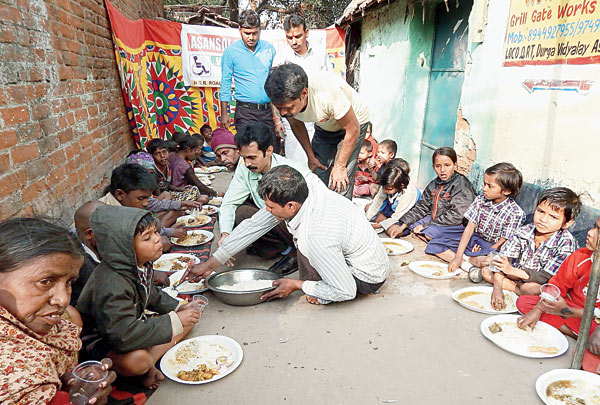 Physically challenged people feeds Underprivileged children