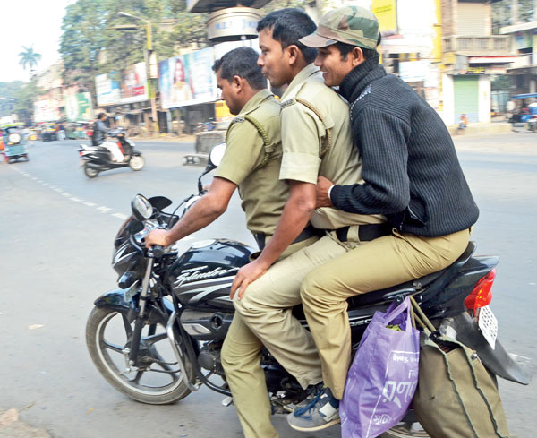 Police is riding bikes without helmet