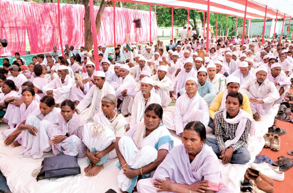 Gandhi followers want their land back