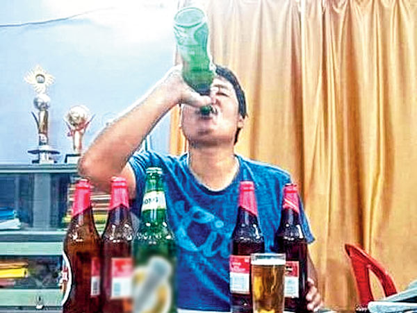 BDO of Tufanganj enjoying beer in his office