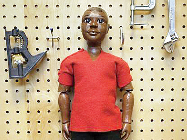 College student designs dolls for boys