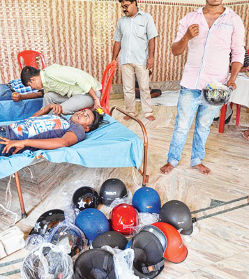 Helmet presented to every blood donors at Blood camp