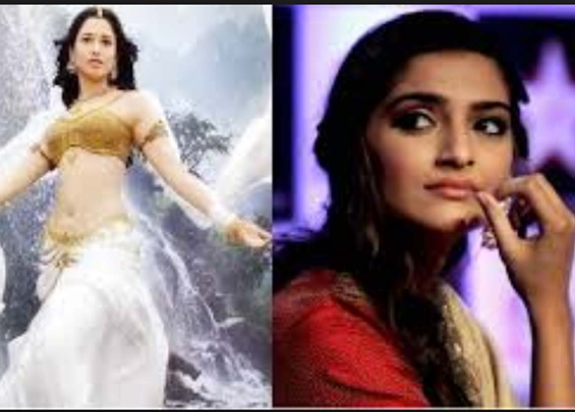 অবন্তিকা: মহেন্দ্র বাহুবলীর প্রেমিকা অবন্তিকার ভূমিকায় কার অভিনয় করার কথা ছিল জানেন? সকলের কাছেই খুব জনপ্রিয় অভিনেত্রী সোনম কপূরের। কিন্তু পরিচালকের শর্ত মানতে সোনম রাজি হননি। এই ছবির জন্য তাঁকে ২ বছর লক-ইন পিরিয়ডে থাকতে হত। নিজের কেরিয়ারের কথা ভেবেই এই শর্ত মানেননি সোনম। এখন নিশ্চয় বুঝতে পারছেন নিজের অজান্তেই কেরিয়ারের কত বড় ক্ষতি করে ফেলেছেন! ছবিতে অবন্তিকায় ভূমিকায় রয়েছেন তামান্না।