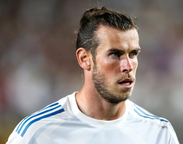 গ্যারেথ বেল: টোটেনহ্যামের সঙ্গে ৬ বছরের সম্পর্ক ছিন্ন করে ২০১৩ সালে ১০ কোটি ১০ লক্ষ টাকার বিনিময়ে রিয়াল মাদ্রিদে সই করেন বেল। ছবি: এএফপি।