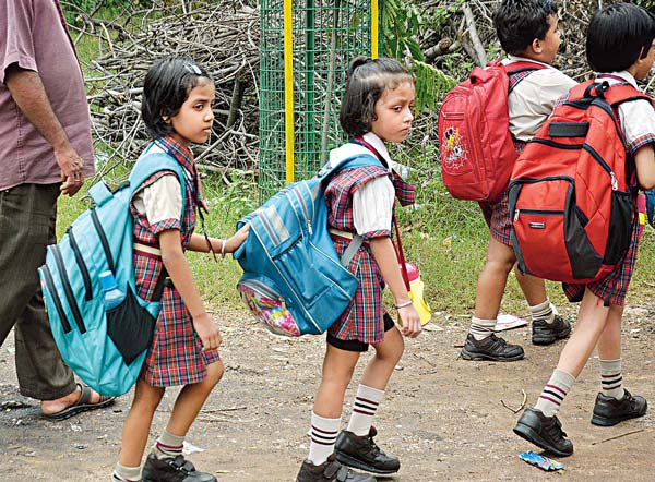 Children suffer as heavy school bags add extra burden