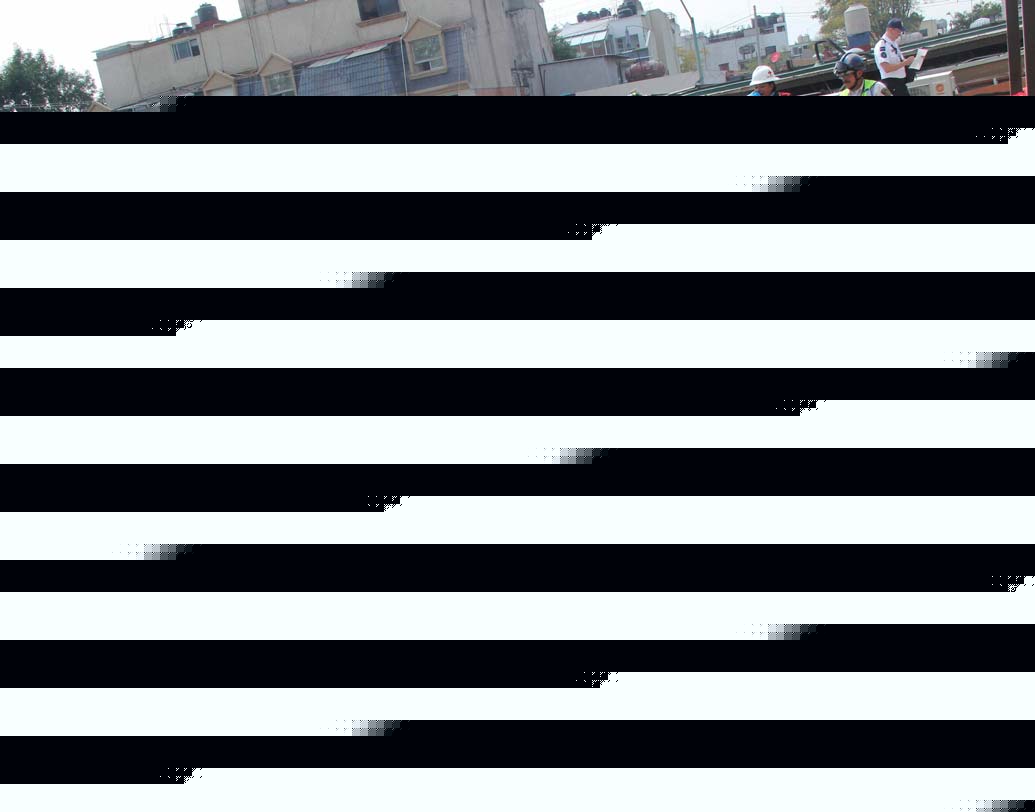 প্রায় মাটিতে মিশে গিয়েছে স্কুল। পড়ুয়াদের খোঁজে নেমেছেন উদ্ধারকারী দলের সদস্যেরা । ছবি: এপি।