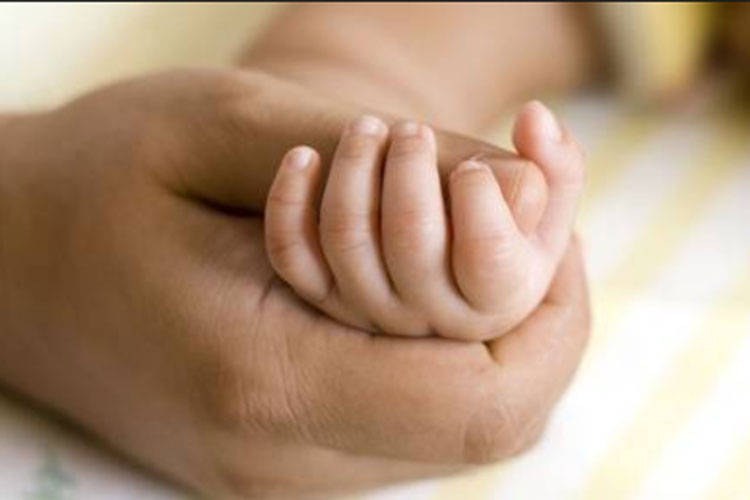 A woman handed over to police as she was not her self and not being attentive to her Infant child