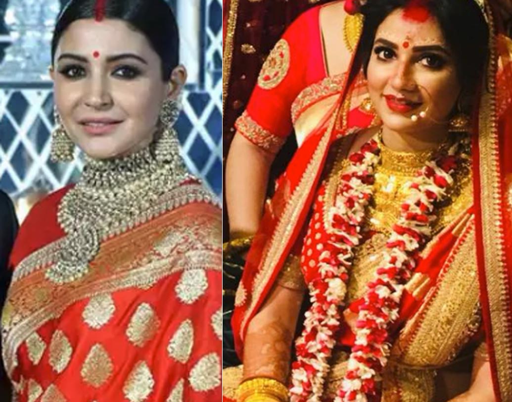 বেনারসী: দিল্লি রিসেপশনে যে বেনারসী শাড়িটি অনুষ্কা পরেছিলেন, শুভশ্রীর বিয়ের শাড়িটাও অনেকটাই এক। আর এক হবে নাই বা কেন? দুটি বেনারসীই ডিজাইন করেছেন সব্যসাচী মুখোপাধ্যায়। বেনারসীর ভিতরে যে সোনালি রঙের কারুকার্য রয়েছে, তাও হুবহু নাকি মিলে যাচ্ছে বলে দাবি নিন্দুকদের।