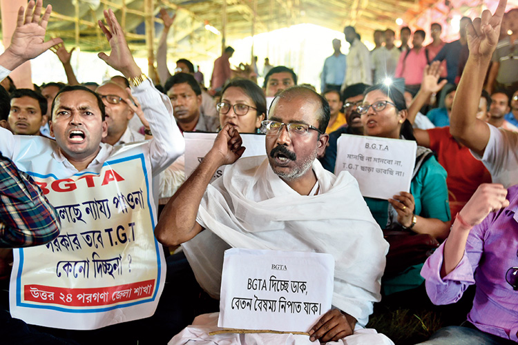 Teachers staged a sit-in protest demanding equal pay
