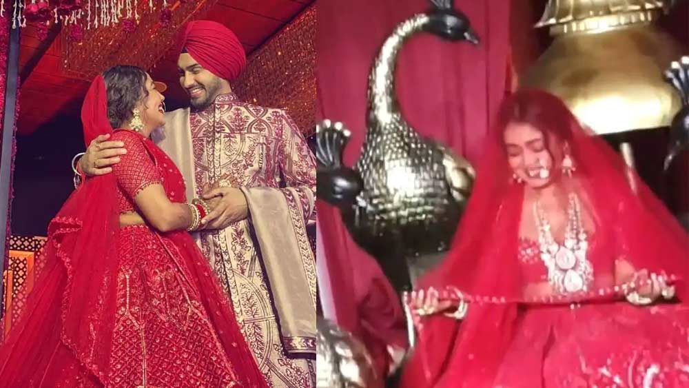 বিয়েতে একটি লাল লেহঙ্গাতেও দেখা গিয়েছে নেহাকে। সেটি নাকি রিসেপশনের দিন প্রিয়ঙ্কা চোপড়ার সব্যসাচীর লেহঙ্গার মতোই, অনেকে এমনই লিখেছেন।