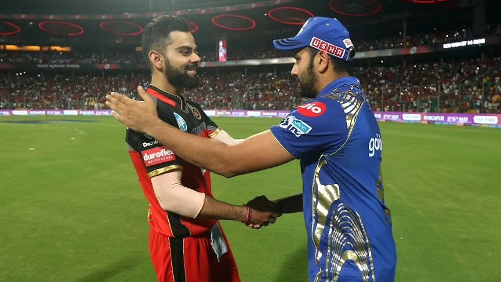 আইপিএলে নেতা হিসাবে রোহিতের দুর্দান্ত সাফল্য দেখে ইতিমধ্যেই বহু প্রাক্তন ক্রিকেটার জাতীয় টি২০ দলের নেতৃত্বে তাঁকে আনার বিষয়ে সওয়াল করছেন। সত্যিই কি রোহিত শর্মার অধিনায়কত্বে দল অনেক এগিয়ে থাকছে বিরাটের থেকে? পরিসংখ্যান কী বলছে?