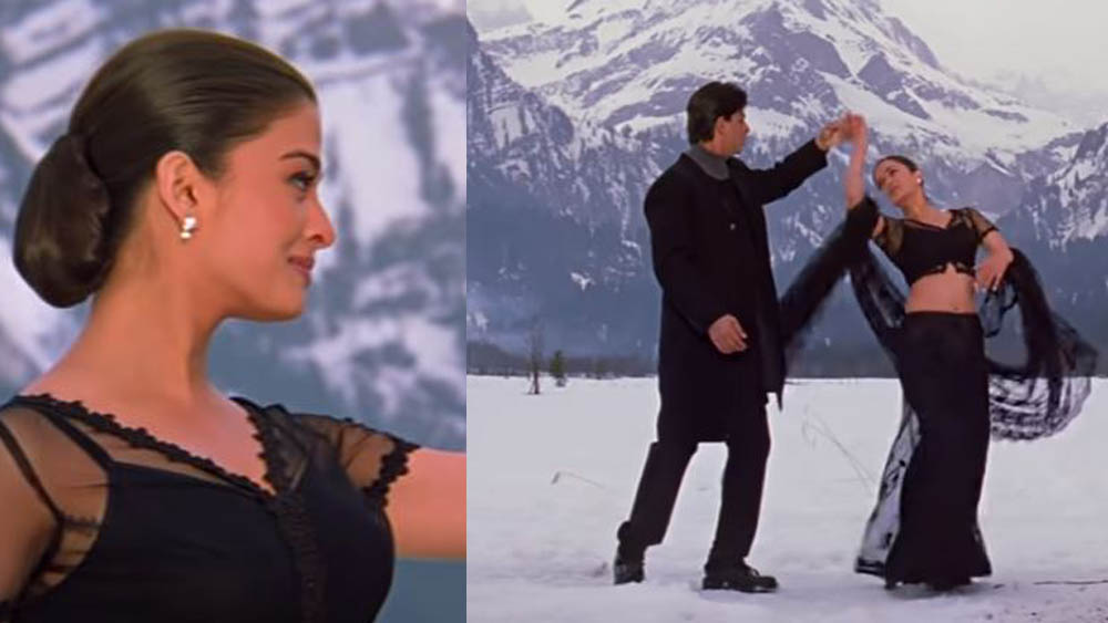 মনে আছে সেই গানের দৃশ্যে শাহরুখ এবং ঐশ্বর্যের পরিহিত পোশাকের কথা? হাইনেক উলিকট গায়ে চাপিয়েছেন বাদশা। আর বিশ্বসুন্দরীর কপালে জুটেছে কালো ট্রান্সপারেন্ট শাড়ি।