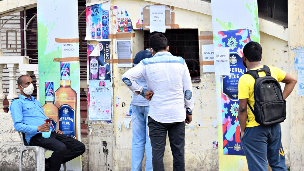 West Bengal Lockdown: Long queues seen outside liquor shops in Purulia