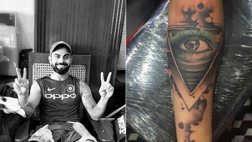 ‘গডস আই’ নামে ট্যাটু রয়েছে বিরাটের। যার মানে হল, যা-ই ঘটুক না কেন, কেউ না কেউ নজর রাখছে তাঁর উপর। অর্থাৎ, উপরওয়ালা সব সময় নজর রাখছেন বিরাটের উপরে।