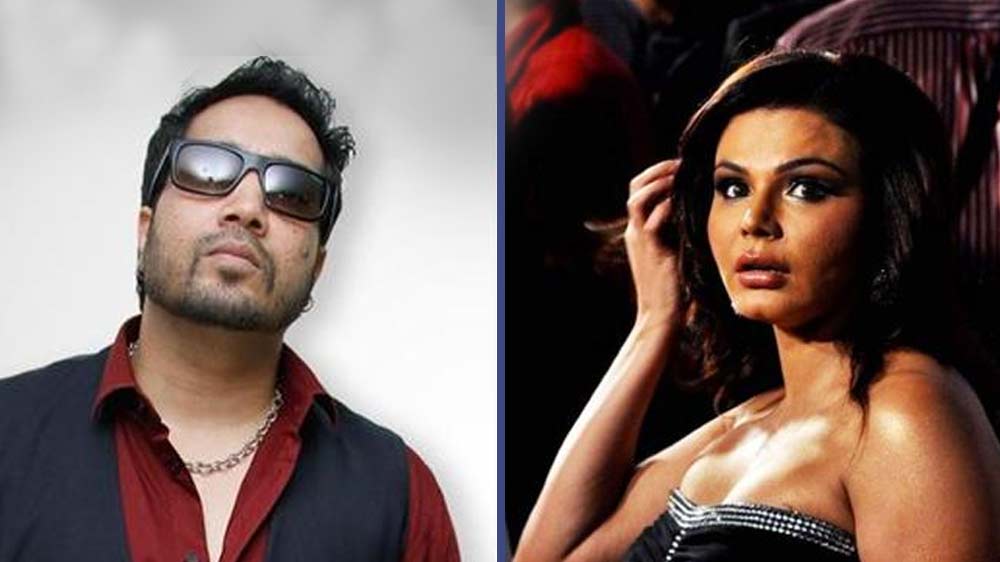 নিজের জন্মদিনের পার্টিতে রাখি সবন্তকে আচমকাই সবার সামনে জোর করে চুমু খেয়েছিলেন মিকা। তা নিয়ে কম জলঘোলা হয়নি। রাখি তো রীতিমতো শ্লীলতাহানির অভিযোগ এনেছিলেন মিকার বিরুদ্ধে। মিকা বলেছিলেন রাখিকে নাকি তিনি ‘উচিত শিক্ষা’ দিয়েছিলেন। কী হয়েছিল?