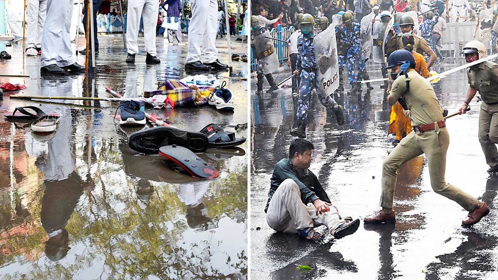 রণক্ষেত্র:  পুলিশের লাঠি থেকে বাঁচতে দৌড়ে পালানোর সময়ে খুলে গিয়েছে জুতো। রাস্তায় পড়ে যাওয়া এক মিছিলকারীকে লাঠিপেটা করতে উদ্যত পুলিশ। 