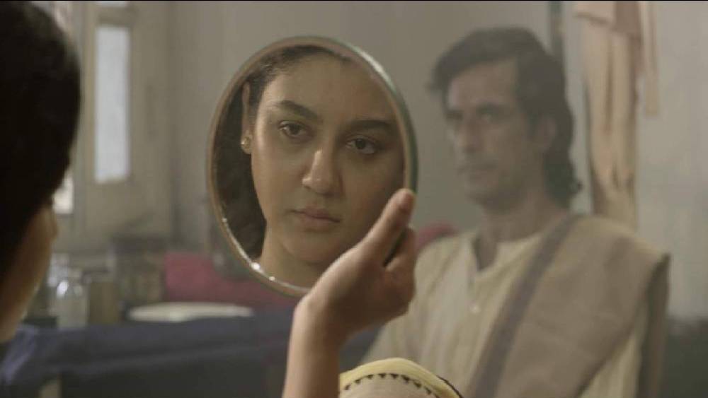 ‘অলাতচক্র’  ছবির একটি দৃশ্য।