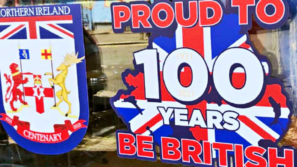 উদ্‌যাপন: উত্তর আয়ারল্যান্ডের শতবর্ষ উপলক্ষে পোস্টার পড়েছে বেলফাস্টে।