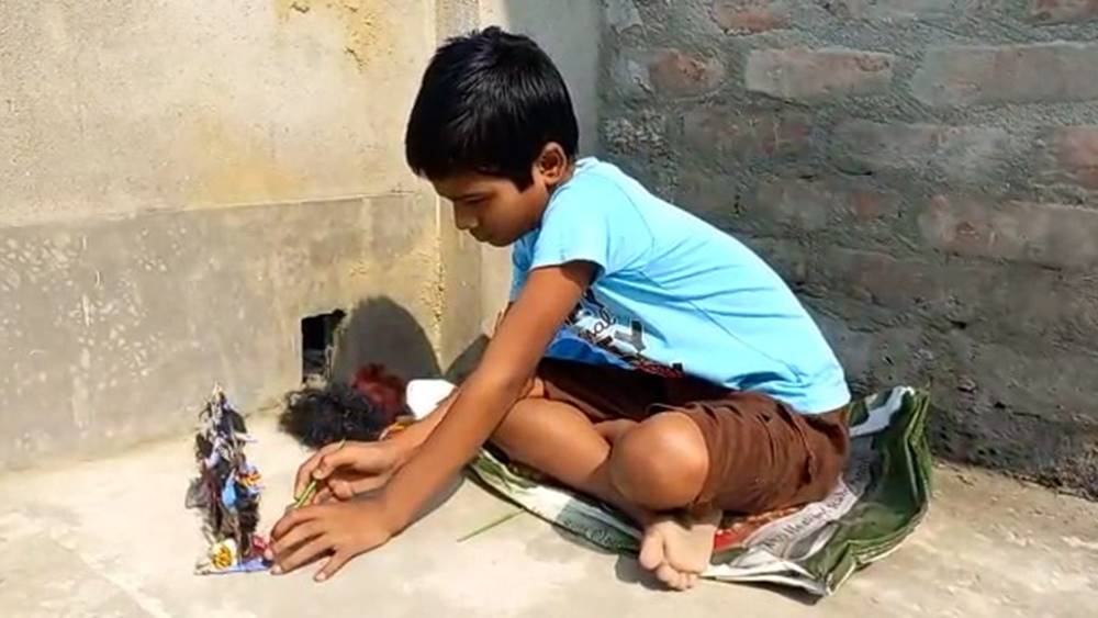 Debajyoti Sarkar making idol of Kali and singing Shayama Sangeet dgtld