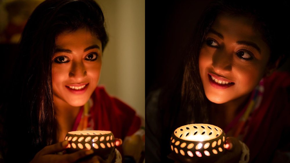হাতে ধরা প্রদীপ। আগুন আলোয় উজ্জ্বল পাওলি দাম। এক মুঠো আলো ছড়ালেন নিজেই।