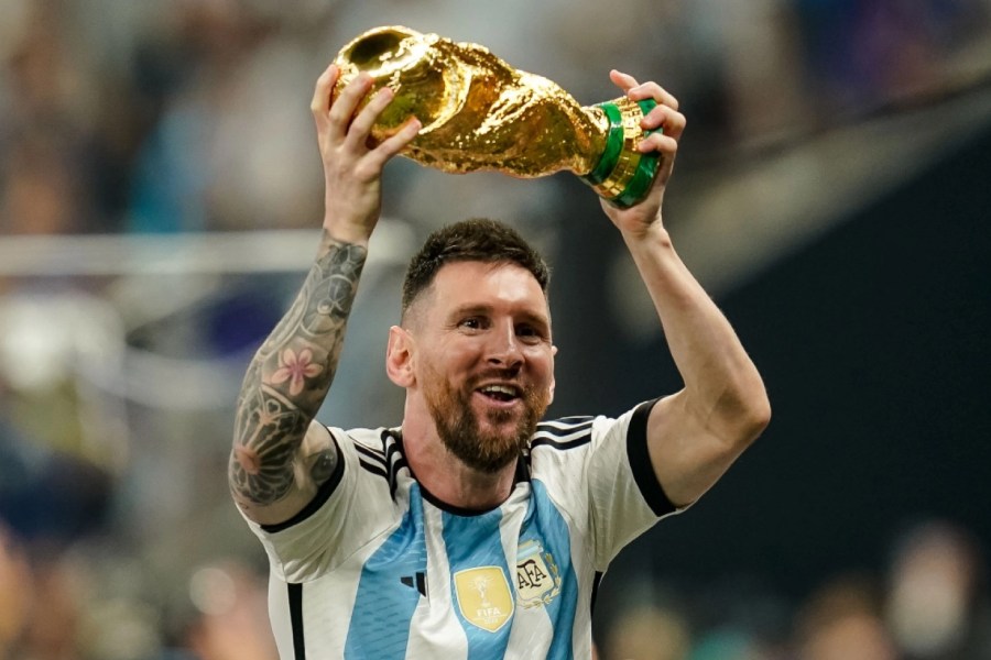 Argentina star Lionel Messi with the world cup trophy