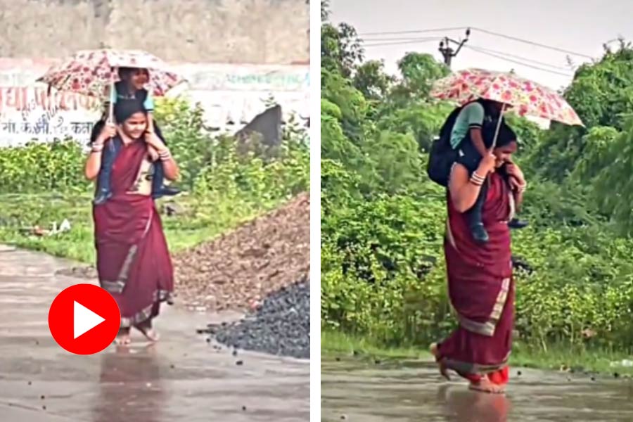 Heartwarming video of mother carrying daughter on her shoulders in the rain goes viral internet loves it dgtl