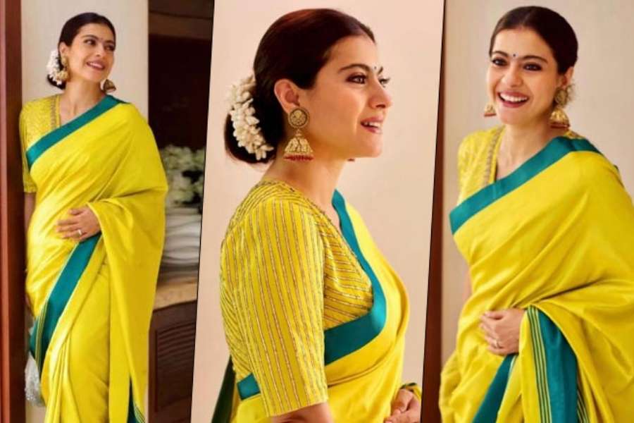 পরনে হলুদ সিল্কের শাড়ি, খোঁপায় ফুলের মালা, কানে ঝুমকো দুলে কাজল আদ্যোপান্ত বাঙালি। পুজোয় আপনার স্টাইলেও থাকতে পারে এই লুক।