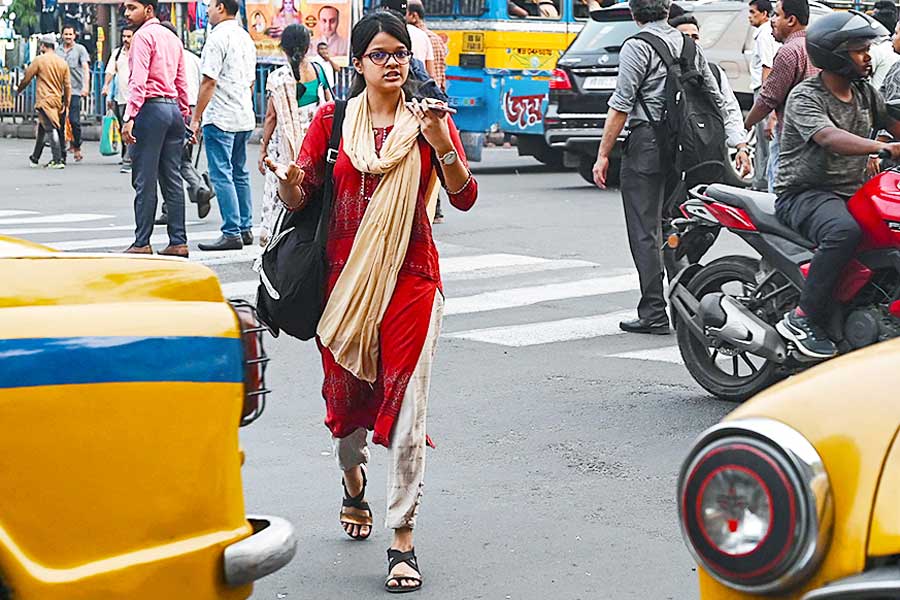 A Photograph of a girl crossing road