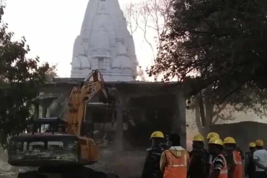 Bulldozer at Indore temple to demolish illegal structure after 36 devotees died.