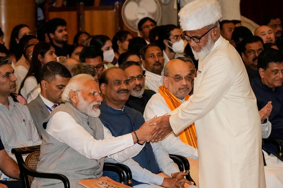 A Photograph of Shah Rashid Ahmed Quadri  with Prime Minister Narendra Modi and Amit Shah 