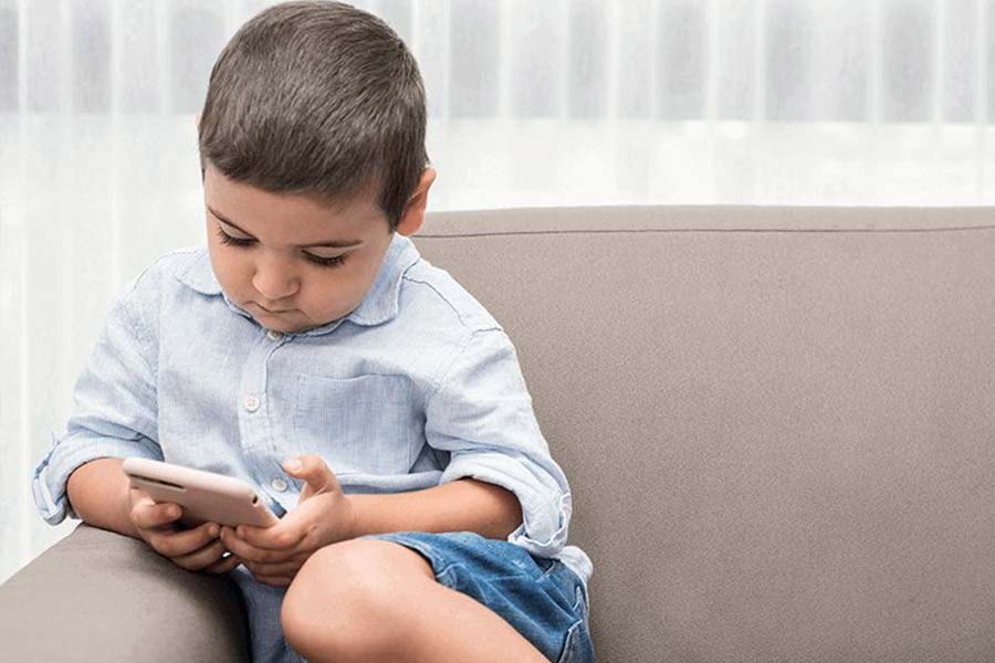 Image of child sitting with mobile