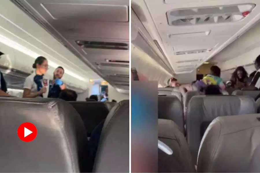 Four passengers arrested in Australia for fighting inside flight that cause emergency landing.