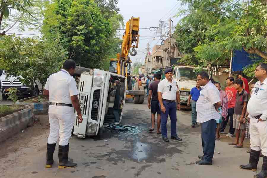 A car turned after hit divider in Thakurpukur of Behala , two school students injured
