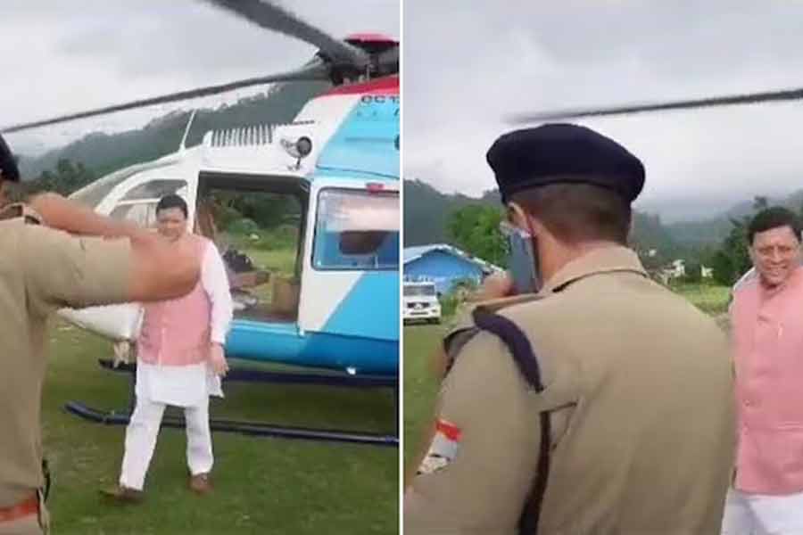 Cop transferred saluting Uttarakhand Chief Minister Pushkar Singh Dhami while talking on phone