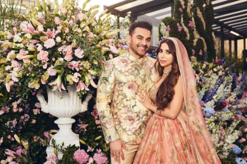 প্যাস্টেল রঙের গলাবন্ধে আরবাজ়। একই রঙের লেহঙ্গায় সুরা। বিয়ের শেষে কেক কেটে, ওয়াইনের বোতল খুলে উদ্‌যাপন করছেন আরবাজ়। বিয়ের পর বোন অর্পিতা খানের বাড়িতে বসে গানের আসর। নববধূর জন্য গাইছেন ‘তেরে মস্ত মস্ত ইয়ে নয়ন’। 