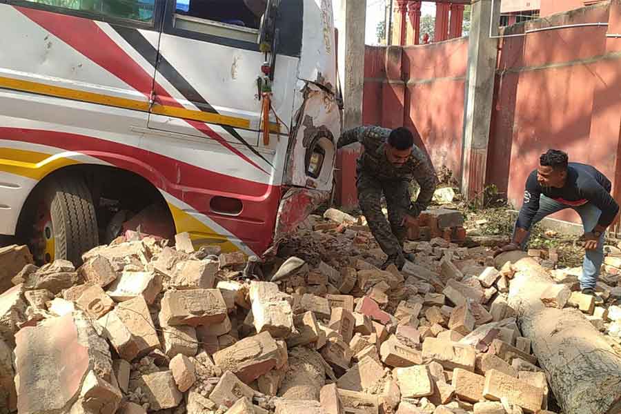 A bus breaks the wall of a school by accident at Jhargram