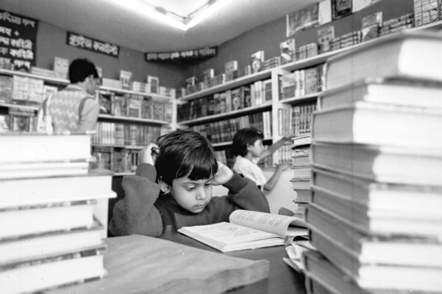 Picture of a boy reading book.