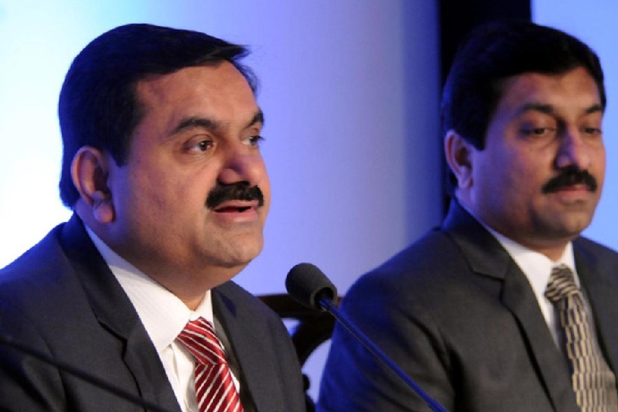 A photograph of Indian businessman Gautam Adani and his brother Rajesh Adani.