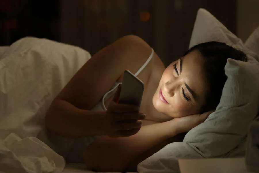 Image of Using Mobile Phone at Night.