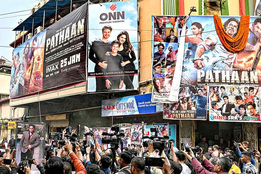 A Photograph of fans celebrating after the release of Pathaan in Cinema Halls
