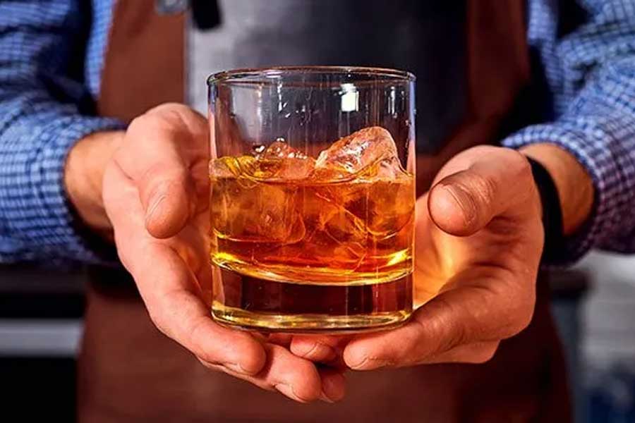 file image of scotch whiskey poured in a glass