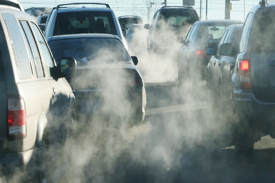 A Photograph of vehicles emitting Carbon.