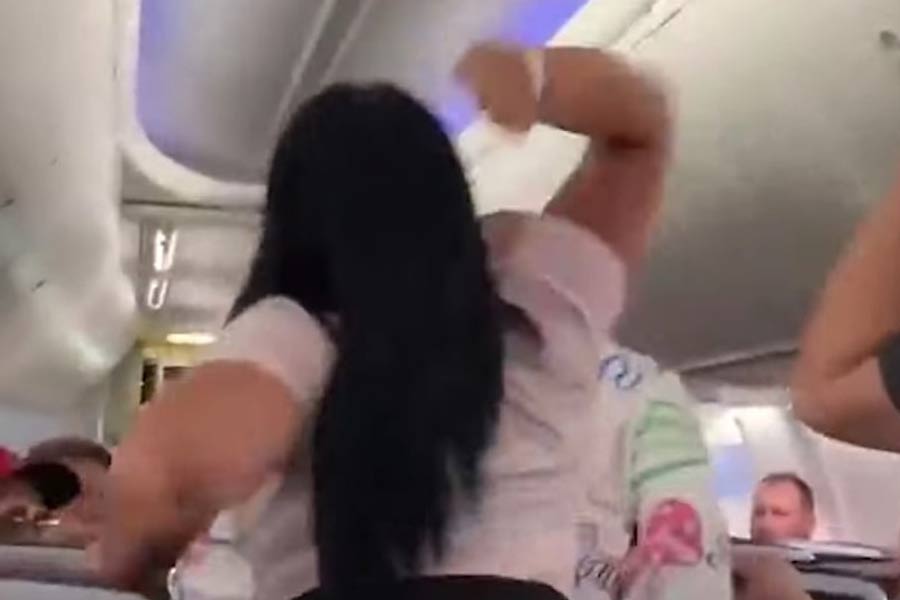 Woman allegedly goes topless to protest after being stopped from smoking inside Russian flight.