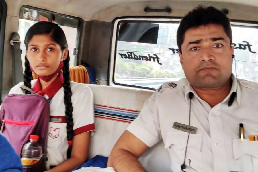 Picture of Traffic police officer Souvik Chakraborty and Madhyamik Examinee