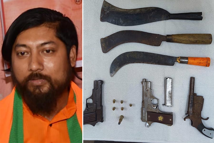 Picture of Nishith Pramanik and the arrested weapons.
