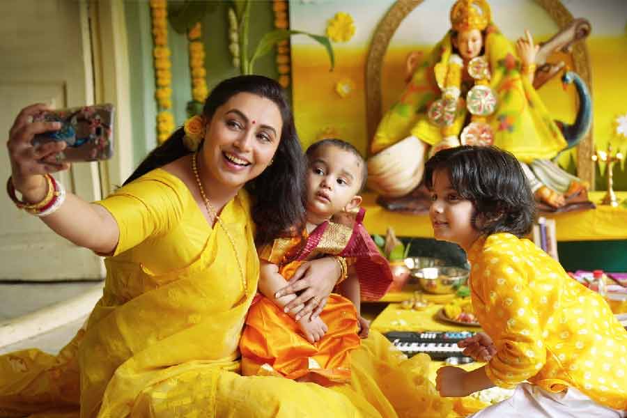 Rani Mukhopadhyay worshiping Bagdevi, with two children!  What is going on?
