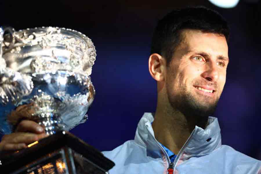 Novak Djokovic with 10th Australian Open trophy