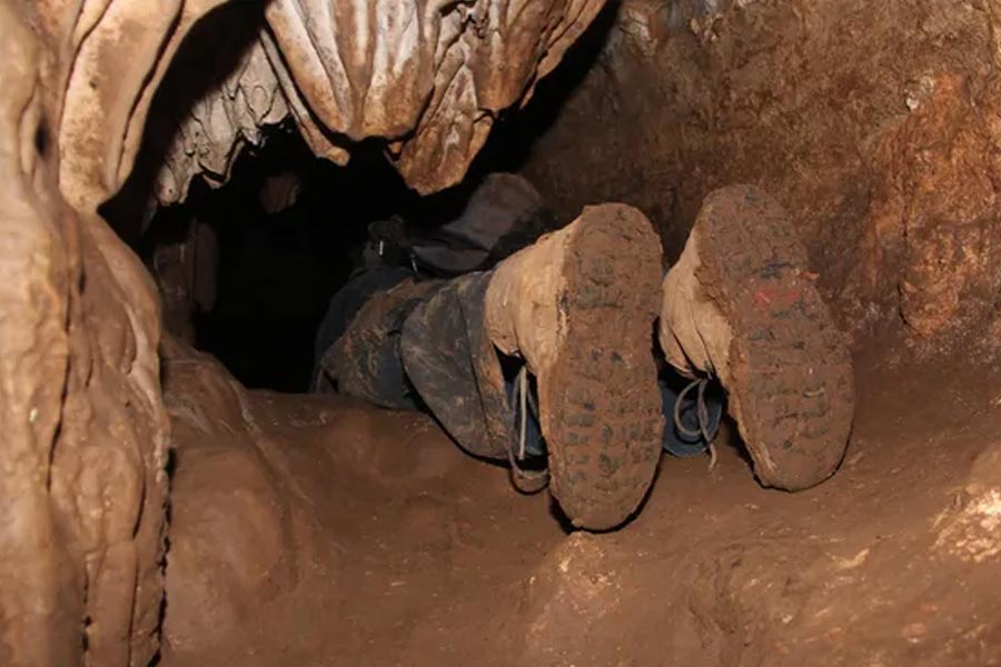 A person trying to enter the mysterious M Cave